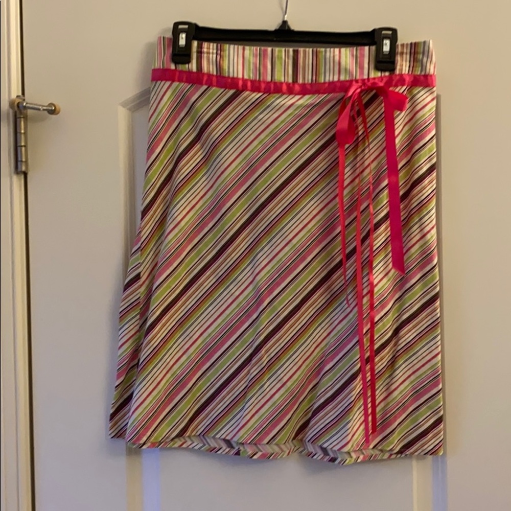 Long skirt with pink and green stripes and bow.
